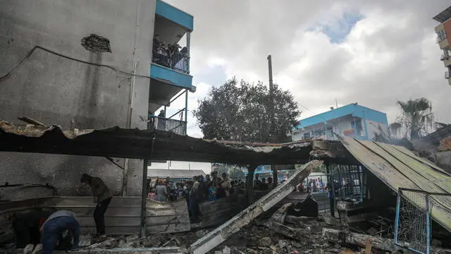epa11339638 A destroyed United Nations school following an air strike in Al Nuseirat refugee camp, central Gaza Strip, 14 May 2024. At least six people were killed in the strike which hit the UNRWA (United Nationas Relief and Works Agency for Palestinians in the near east) school, according to the Palestinian Civil Defense in Gaza. More than 35,000 Palestinians and over 1,455 Israelis have been killed, according to the Palestinian Health Ministry and the Israel Defense Forces (IDF), since Hamas militants launched an attack against Israel from the Gaza Strip on 07 October 2023, and the Israeli operations in Gaza and the West Bank which followed it. EPA/MOHAMMED SABER