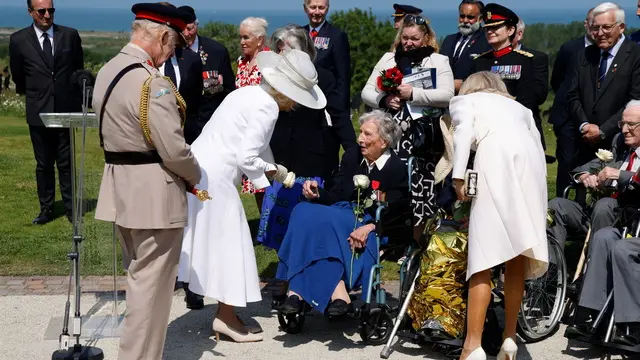 epa11392942 Britain's King Charles III (L) and Britain's Queen Camilla (2-L) greet 104-years-old British World War II veteran, Christian Lamb (C), who helped to plan the D-Day landings in Normandy, after she was awared by France's President with the insignia of Knight in the Legion of Honour order, during the UK Ministry of Defence and the Royal British Legion’s commemorative ceremony marking the 80th anniversary of the World War II 'D-Day' Allied landings in Normandy, at the World War II British Normandy Memorial near the village of Ver-sur-Mer which overlooks Gold Beach in northwestern France, 06 June 2024. The D-Day ceremonies on 06 June this year mark the 80th anniversary since the launch of 'Operation Overlord', a vast military operation by Allied forces in Normandy, which turned the tide of World War II, eventually leading to the liberation of occupied France and the end of the war against Nazi Germany. EPA/LUDOVIC MARIN / POOL MAXPPP OUT
