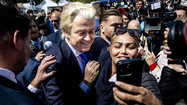 epa11391717 Party for Freedom (PVV) leader Geert Wilders poses for photos with supporters during an election campaign on the Hague Market, Netherlands, 05 June 2024. The PVV leader is campaigning for the European Parliament elections. This year's European Parliament elections are scheduled across EU member states from 06 to 09 June 2024. EPA/REMKO DE WAAL