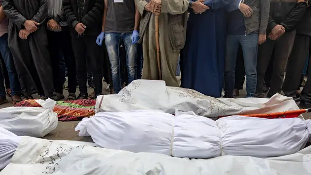 epa11338473 Relatives of Palestinians who were killed after an overnight Israeli air strike in Al Nuseirat camp, mourn next to their wrapped bodies outside al-Aqsa Martyrs Hospital in Deir al-Balah, central Gaza Strip, 14 May 2024. More than 35,000 Palestinians and over 1,455 Israelis have been killed, according to the Palestinian Health Ministry and the Israel Defense Forces (IDF), since Hamas militants launched an attack against Israel from the Gaza Strip on 07 October 2023, and the Israeli operations in Gaza and the West Bank which followed it. EPA/HAITHAM IMAD