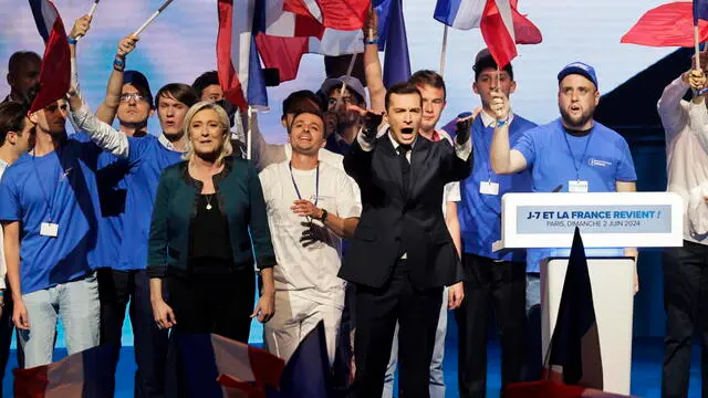 epa11385917 President of the French far-right National Rally party (RN-Rassemblement National in French) Jordan Bardella (C-R) and party's parliamentary leader Marine Le Pen (C-L) react at the end of a meeting for the European election campaign in Paris, France, 02 June 2024. Elections for the European Parliament are due to take place between 06 and 09 June 2024. EPA/ANDRE PAIN