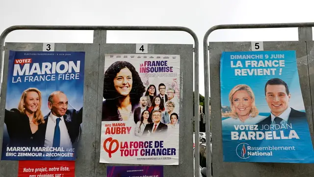 epa11389714 Electoral posters showing Marion Marechal Le Pen of the far-right 'Reconquete', Manon Aubry of French left-wing 'La France Insoumise (LFI)' and Marine Le Pen and Jordan Bardella of the French far-right 'Rassemblement National' on electoral boards along a street in Vence near Nice, southern France, 04 June 2024. This year's European Parliament elections are scheduled across EU member states from 06 to 09 June 2024. EPA/SEBASTIEN NOGIER
