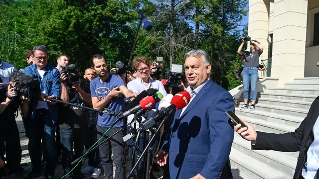 epa11398960 Hungarian Prime Minister Viktor Orban (R), leader of the ruling Fidesz party, speaks to the media after casting his vote at a polling station during the European Parliament and the local elections in Budapest, Hungary, 09 June 2024. The European Parliament elections take place across EU member states from 06 to 09 June 2024. EPA/Szilard Koszticsak HUNGARY OUT