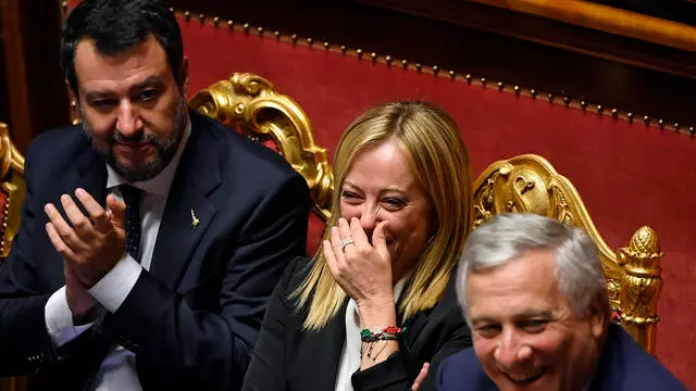 Italian Prime Minister, Giorgia Meloni (C), with Minister of Infrastructure and Transport, Matteo Salvini (L), and Minister of Foreign Affairs, Antonio Tajani (R), ahead of a confidence vote for the new government, at the Senate in Rome, Italy, 26 October 2022. ANSA/RICCARDO ANTIMIANI