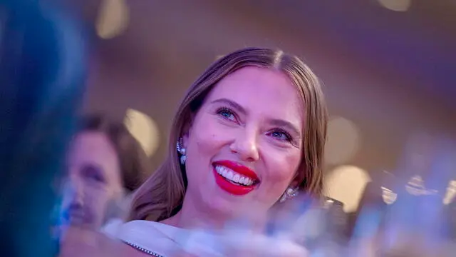 epa11306203 US actor Scarlett Johansson listens to her husband, Comedian Colin Jost, speaking during the White House Correspondentsâ€™ Association dinner at the Washington Hilton in Washington, DC, USA, 27 April 2024. EPA/BONNIE CASH / POOL