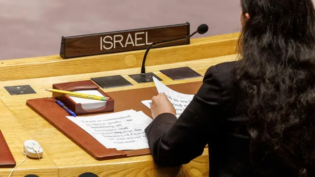 epa11402981 A representative from Israel reads from a written speech after the Security Council voted on a draft resolution on a ceasefire in Gaza during a meeting at UN Headquarters in New York, New York, USA, 10 June 2024. The council ultimately passed a resolution by the United States that supports a plan presented by US President Joe Biden for a ceasefire in the Israel-Gaza conflict. EPA/SARAH YENESEL