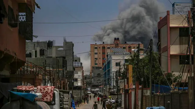 epa11397450 Smoke rises following an air strike during the Israeli military operation in Al Nusairat refugee camp in the central Gaza Strip 08 June 2024. More than 36,000 Palestinians and over 1,400 Israelis have been killed, according to the Palestinian Health Ministry and the Israel Defense Forces (IDF), since Hamas militants launched an attack against Israel from the Gaza Strip on 07 October 2023, and the Israeli operations in Gaza and the West Bank which followed it. EPA/MOHAMMED SABER