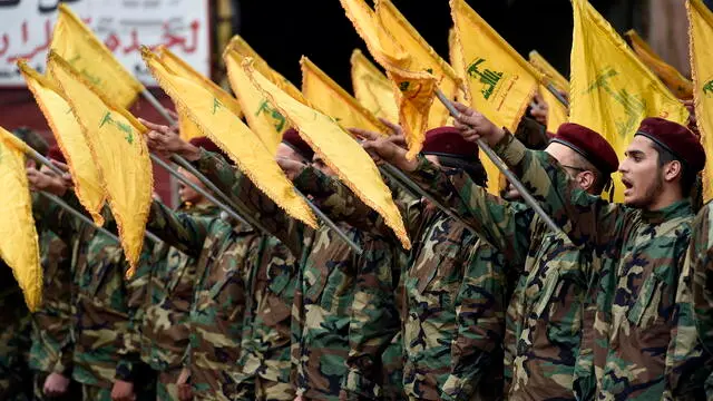 epa11331757 Hezbollah militants take the oath during the funeral of late Hezbollah fighter Hussein Ahmed Hamdan in Beirut, Lebanon, 10 May 2024. According to the Lebanese military, three Hezbollah fighters and a civilian were killed on 09 May in an Israeli airstrike in Lebanon's southern village of Bafliyeh in the district of Tyre. EPA/WAEL HAMZEH