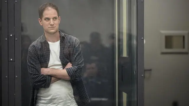 epa11296555 Wall Street Journal correspondent Evan Gershkovich stands in a glass cage during his arrest appeal hearing at the Moscow City Court in Moscow, Russia, 23 April 2024. The court rejected Gershkovich's appeal on his arrest as he is awaiting the trial. Evan Gershkovich, a US journalist at The Wall Street Journal covering Russia, was detained in Yekaterinburg on 29 March 2023. The Russia's Federal Security Service (FSB) claimed that on the instructions of the American authorities, the journalist collected information constituting a state secret about one of the enterprises of the Russian military-industrial complex. He is charged under Art. 276 of the Criminal Code of the Russian Federation - Espionage, which could carry a sentence of up to 20 years. EPA/STRINGER