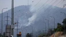 epa11388528 Smoke rises in Kiryat Shmona, northern Israel, following strikes by Hezbollah missiles, 04 June 2024. An Israeli army spokesperson reported that six IDF reservist soldiers were lightly injured as a result of smoke inhalation and transferred to a hospital to receive medical treatment. EPA/ATEF SAFADI