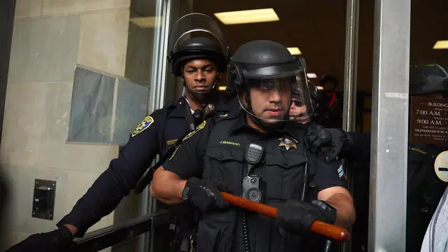 epa11365077 Police push Pro-Palestinian protestors out of the building after they occupied Dodd Hall at the University of California Los Angeles (UCLA) in Los Angeles, California USA, 23 May 2024. The protest coincided with a congressional hearing on campus protests that UCLA Chancellor Gene Block testified. Nationwide demonstrations have sprung up across the country on school campuses, many calling for institutions to divest investments in Israel and support of a ceasefire in the Gaza conflict. EPA/ALLISON DINNER