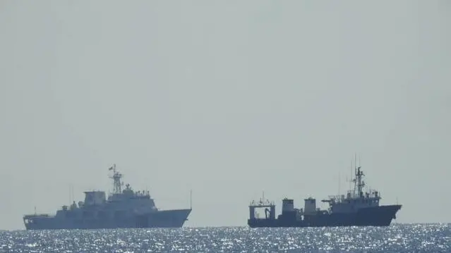 epa09136530 A handout photo made available by the Philippine Coast Guard (PCG) shows a Chinese coast guard ships anchored along the Whitsun Reef, in the Spratly Islands, Philippines on 14 April 2021 (issued on 15 April 2021). Chinese vessels have been mooring in Whitsun Reef in the disputed South China Sea since December 2020 with latest reports that Chinese patrol ships remain anchored in the area. EPA/PCG / HANDOUT HANDOUT EDITORIAL USE ONLY/NO SALES