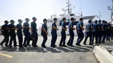 epa11354657 Philippine Coast Guard law enforcement personnel board a patrol ship during a send-off ceremony at a seaport in Manila, Philippines, 20 May 2024. The Philippine Coast Guard deployed additional troops in different Philippine territorial waters, including the disputed South China Sea. EPA/FRANCIS R. MALASIG