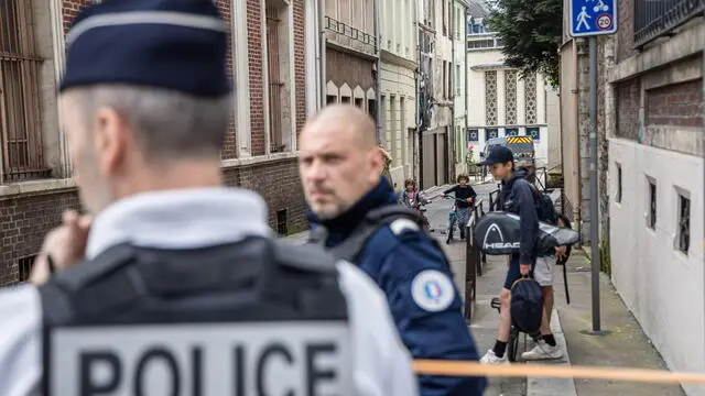 epa11347399 French police officers stand guard in a street outside a synagogue, where a man was shot, in Rouen, northern France, 17 May 2024. According to the prosecutor of the city of Rouen, the police were called early 17 May morning after smoke was seen inside the synagogue. The suspect threatened an officer with a knife and the policeman used his service weapon in response. EPA/CHRISTOPHE PETIT TESSON