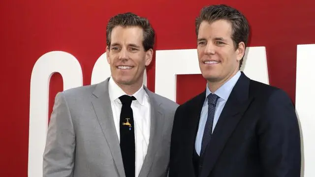 epa07034985 (FILE) - Internet entrepreneurs Cameron Winklevoss (L) and Tyler Winklevoss (R) arrive for the premiere of the film 'Ocean's 8' at the Alice Tully Hall in New York, New York, USA, 05 June 2018 (reissued 20 September 2018). According to media reports, the twins will launch a new crypto dollar called Gemini dollar that allows people to exchange US dollars into Gemini dollars and back as well as to move money around the globe. The Gemini dollars will be deposited in a US bank, State Street. EPA/JASON SZENES *** Local Caption *** 54387212
