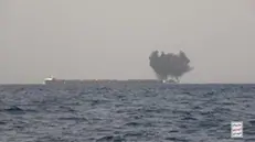 epa11424199 A screengrab from footage made available by the Houthis media center shows smoke rising from an explosion at the Liberian-flagged, Greek-owned bulk carrier M/V Tutor after an attack by an unmanned Houthi exploding boat in the Red Sea, 12 June 2024 (issued 19 June 2024). According to a statement by the Houthis on 19 June 2024, Yemen's Houthis launched on 12 June 2024 an unmanned exploding boat and missile attack against the Liberian-flagged, Greek-owned bulk carrier M/V Tutor in the Red Sea, which left one crew member dead and sunk the vessel. EPA/HOUTHIS MEDIA CENTER / HANDOUT BEST QUALITY AVAILABLE HANDOUT EDITORIAL USE ONLY/NO SALES HANDOUT EDITORIAL USE ONLY/NO SALES