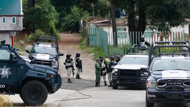 epa11023811 Members of the State Police patrol in the Texcapilla sector, in the town of Texcaltitlan, in the central State of Mexico, Mexico, 11 December 2023. The governor of the State of Mexico, Delfina Gomez, announced that they will maintain continuous surveillance and will install a National Guard base in the town of Texcapilla, where residents confronted members of the 'Familia Michoacana' cartel on 08 December, leaving 14 dead people, including 10 alleged criminals. EPA/Felipe Gutierrez