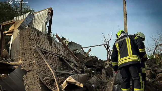 epa11431773 A handout picture made available by the State Emergency Service shows Ukrainian rescuers working at the site of a rocket attack on a village near Kyiv, Ukraine, 23 June 2024, amid the Russian invasion. At least two people were injured as a result of an overnight Russian rocket attack on the Kyiv region according to the State Emergency Service. Russian troops entered Ukrainian territory on 24 February 2022, starting a conflict that has provoked destruction and a humanitarian crisis. EPA/STATE EMERGENCY SERVICE HANDOUT HANDOUT EDITORIAL USE ONLY/NO SALES HANDOUT EDITORIAL USE ONLY/NO SALES