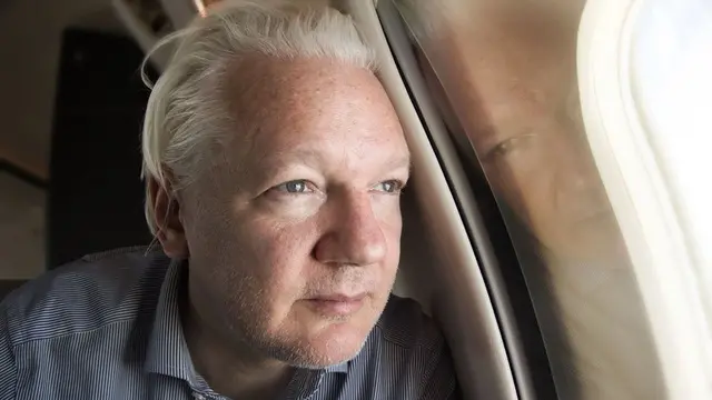 epa11437633 A handout photo made available by WikiLeaks shows WikiLeaks founder Julian Assange looking out of the window of a plane while approaching Bangkok for a layover at Don Mueang International Airport, Thailand, 25 June 2024. Julian Assange's flight VJT199 took off from Bangkok on 25 June, heading towards US airspace and Saipan Island, following a layover in the Thai capital. According to court filings in the US district court for the Northern Mariana Islands, US prosecutors said they anticipate Assange will plead guilty to the criminal count of conspiring to obtain and disclose classified documents relating to the national defense of the United States. WikiLeaks posted a statement on social media saying that Assange was freed from Britain's Belmarsh maximum security prison on 24 June morning, after having spent 1,901 days there. He was granted bail by the High Court in London and was released at Stansted Airport during the afternoon. Following his release on bail, he departed the UK for Australia. His wife Stella confirmed on X that 'Julian is free' and thanked supporters. EPA/WIKILEAKS HANDOUT -- MANDATORY CREDIT -- BEST QUALITY AVAILABLE -- HANDOUT EDITORIAL USE ONLY/NO SALES HANDOUT EDITORIAL USE ONLY/NO SALES