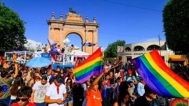 epa10021469 Hundreds of people participate in the gay pride march in the city of Leon, in the state of Guanajuato, Mexico, 18 June 2022. Groups and supporters of the LGTBQ+ community demonstrated in various cities in Mexico to demand respect for their rights, to eradicate discrimination, and for legal recognition of the diversity of their gender. EPA/Luis Ramirez