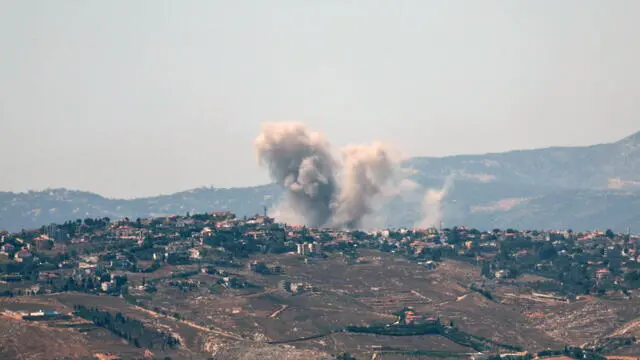 epa11436621 Smoke rises as a result of an Israeli air strike in the southern Lebanese town of Khiam, as seen from Snir, northern Israel, 25 June 2024. According to an Israeli army report, the IDF Aerial Defense Array successfully intercepted a suspicious aerial target that crossed from Lebanon, and Israeli fighter jets struck Hezbollah military structures in the areas of Khiam and Odaisseh in southern Lebanon on 25 June. EPA/ATEF SAFADI