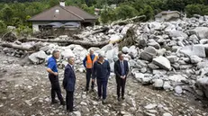 epa11432238 (L-R) William Kloter, commander of the Cantonal Police of Graubuenden, Swiss Federal Councillor Ignazio Cassis, Jon Domenic Parolini, President of the Government of canton Graubuenden and Christian Vitta, President of the Government of canton Ticino, inspect the site of a landslide, caused by severe weather and heavy rain in the Misox valley, in Sorte village, Lostallo, southern Switzerland, 23 June 2024. One person was found dead and two others were still missing after massive thunderstorms and rainfall led to a flooding situation with large-scale landslides on 22 June evening in the Misox valley, south-eastern Switzerland. Several dozen people had to be evacuated from their homes. EPA/MICHAEL BUHOLZER