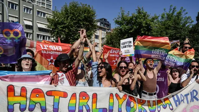 epa11447338 Members of LGBTIQ+ community wave rainbow-colored flags and shout slogans during the Pride March in Istanbul, Turkey, 30 June 2024. The Turkish Government has banned the Istanbul Pride March as they already did in previous years. EPA/ERDEM SAHIN