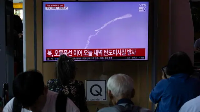 epa11438241 People watch the news at a station in Seoul, South Korea, 26 June 2024. According to South Korea's Joint Chiefs of Staff (JCS), North Korea launched a Ballistic Missile into the East Sea on 26 June. EPA/JEON HEON-KYUN