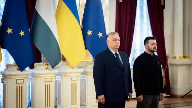 epa11451894 A handout photo made available by the Hungarian Prime Minister's Press Office shows Hungarian Prime Minister Viktor Orban (L) is welcomed by Ukrainian President Volodymyr Zelensky (R) prior to a meeting in Kyiv, Ukraine, 02 July 2024. The Hungarian prime minister arrived in Kyiv to discuss 'European peace' with the Ukrainian president as well as current issues in Hungarian-Ukrainian bilateral relations, the Hungarian government spokesman Zoltan Kovacs said. This is Orban's first official visit to Ukraine since the beginning of the Russian invasion in 2022. EPA/ZOLTAN FISCHER/HUNGARIAN PM'S PRESS OFFICE HANDOUT HANDOUT EDITORIAL USE ONLY/NO SALES