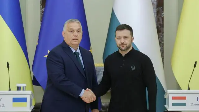 epa11452239 Ukrainian President Volodymyr Zelensky (R) and Hungarian Prime Minister Viktor Orban (L) shake hands at the end of a joint press conference after their meeting in Kyiv, Ukraine, 02 July 2024. The Hungarian prime minister arrived in Kyiv to discuss 'European peace' with the Ukrainian president as well as current issues in Hungarian-Ukrainian bilateral relations, the Hungarian government spokesman Zoltan Kovacs said. This is Orban's first official visit to Ukraine since the beginning of the Russian invasion in 2022. EPA/SERGEY DOLZHENKO