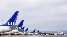 epa07529646 SAS airplanes on a tarmac at the Oslo Gardermoen airport during SAS Scandinavian airlines pilots strike in Oslo, Norway, 26 April 2019. Hundreds of SAS Scandinavian airlines pilots from Norway, Sweden and Denmark went on strike after talks on wage failed. According to reports, some 170,000 travellers can be affected with cancelled or delayed flights during the weekend. EPA/OLE BERG RUSTEN NORWAY OUT