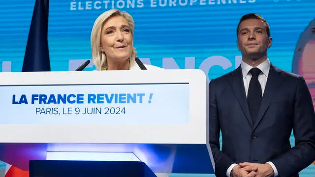 epa11400727 National Rally parliamentary party leader Marine Le Pen (L) delivers a speech next to leader Jordan Bardella (R) at the electoral party of the French right-wing party National Rally (Rassemblement National or RN) in Paris, France, 09 June 2024, after the first results of the European elections. The list of the Rassemblement National, led by party chief Jordan Bardella, is given winner in France according to first estimations after polls. EPA/ANDRE PAIN