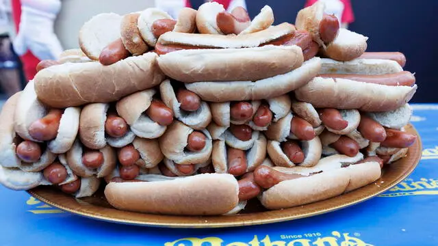 epa11455570 Hot dogs are plated during weigh-in ceremony for Nathan's Famous Fourth of July International Hot Dog Eating Contest in New York, New York, 03 July 2024. Nathan's Annual Fourth of July International Hot Dog Eating Contest will take place 04 July in Coney Island, when contestants will attempt to eat as many hot dogs and buns as they can in 10 minutes. EPA/SARAH YENESEL