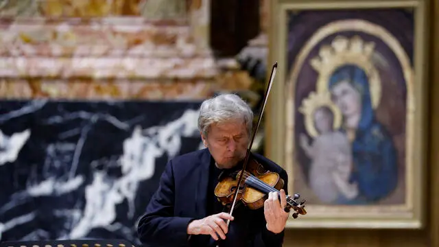 Italian violinist Uto Ughi performs during the fourth appointment with the new cycle 'Lectio Petri - Peter in the Acts of the Apostles' St. Peter Basilica, Vatican, 27 February 2024. ANSA/FABIO FRUSTACI