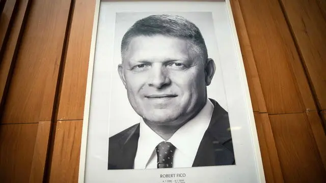 epa11359522 A portrait of Slovak Prime Minister Robert Fico is seen on the wall of the Government Office of the Slovak Republic in Bratislava, Slovakia, 22 May 2024. Slovak Prime Minister Robert Fico was shot and injured in Handlova on 15 May and transported to a hospital in a life-threatening condition; the shooting suspect was arrested on spot. EPA/JAKUB GAVLAK