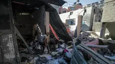 epa11435791 Palestinians inspect the destroyed home of Nasr family following an Israeli air strike in the Al-Maghazi refugee camp, southern Gaza Strip, 25 June 2024. According to a report from the Palestinian Ministry of Health, five Palestinians were killed and more than 12 injured overnight in an Israeli air strike on the Al-Maghazi refugee camp. More than 37,000 Palestinians and over 1,400 Israelis have been killed, according to the Palestinian Health Ministry and the Israel Defense Forces (IDF), since Hamas militants launched an attack against Israel from the Gaza Strip on 07 October 2023, and the Israeli operations in Gaza and the West Bank which followed it. EPA/MOHAMMED SABER