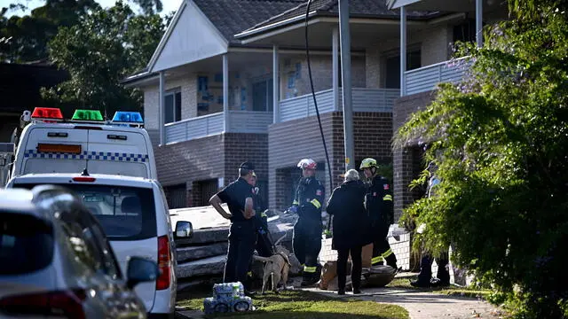 epa11386566 NSW Fire and Rescue work at the scene of a collapsed townhouse in Whalan, Sydney, Australia 03 June 2024. The body of a woman has been found days after a townhouse exploded in Sydney's west. EPA/BIANCA DE MARCHI AUSTRALIA AND NEW ZEALAND OUT