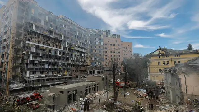 epa11466556 Ukrainians working at the site of a rocket strike on the 'Okhmadyt' children's hospital in Kyiv, Ukraine, 08 July 2024 amid the undoing Russian invasion. Russia massively attacked Ukraine with missiles 08 July, striking Kyiv, Dnipro, Kryvyi Rih, Sloviansk and Kramatorsk. More than 40 missiles of different types were launched, striking residential buildings, infrastructure and the children's hospital. At least seven people were killed and 25 injured as result of shelling in Kyiv according to the State Emergency Service report. EPA/SERGEY DOLZHENKO