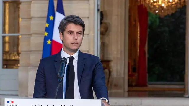 epaselect epa11466050 French Prime Minister Gabriel Attal addresses the media after the announcement of the results of the second round of the legislative elections at Hotel Matignon in Paris, France, 07 July 2024. Attal announced that he would hand in his resignation on 08 July. France voted in the second round of the legislative elections on 07 July. According to the first official results, the left-wing New Popular Front (Nouveau Front populaire, NFP) was ahead of President Macron's party and Le Pen's far-right National Rally (RN). EPA/VALENTINA CAMU