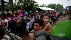 epa10875475 Migrants line up to be transferred in canoes to the humanitarian shelters of Lajas Blancas, at the indigenous town of Bajo Chiquito, Panama, 15 September 2023 (issued 21 September 2023). According to official data provided by Panama, more than 385,000 people have crossed the Darien so far this year, a record number compared to 248,000 in all of 2022, the largest record to date. The UN rights office (OHCHR) on 05 September warned that the unprecedented number of migrants who continue to cross the dense tropical jungle between Colombia and Panama known as the Darien Gap are risking their lives and facing horrific human rights abuses. Panama has already prepared three migration centers to provide shelter, food, health care and water and sanitation for those on the move, however, capacity remains stretched, and the OHCHR warned that amid rising numbers of incoming refugees and migrants, providing protection and aid was increasingly challenging for the authorities. EPA/Bienvenido Velasco ATTENTION: This Image is part of a PHOTO SET