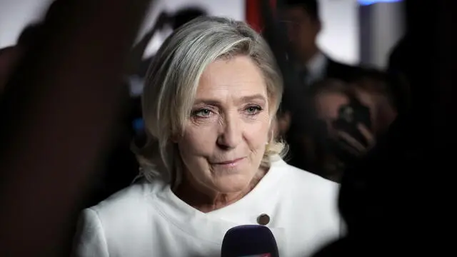 epaselect epa11465845 Member of Parliament for the French right-wing party National Rally (Rassemblement National, RN), Marine Le Pen addresses journalists at the party's headquarters after preliminary results of the second round of the French parliamentary elections, in Paris, France, 07 July 2024. France voted in the second round of the legislative elections on 07 July. According to the first official results, the left-wing New Popular Front (Nouveau Front populaire, NFP) was ahead of President Macron's party and Le Pen's far-right National Rally (RN). EPA/CHRISTOPHE PETIT TESSON