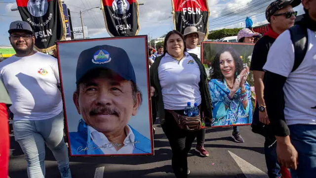 epa10462392 Demonstrators march with a picture of Nicaragua President Daniel Ortega, in Managua, Nicaragua, 11 February 2023. Hundreds of supporters of the pro-government Sandinista National Liberation Front (FSLN) took to the streets in different Nicaraguan cities to celebrate the expulsion of 222 Nicaraguans critical of the government and accused of treason. EPA/Jorge Torres