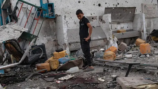 epa11464094 A Palestinian inspects the damages after the Israeli air strike hit UNRWA's Al-Jaouni School housing displaced people in the Nuseirat refugee camp in the central Gaza Strip, 06 July 2024. At least 16 people have died and 50 are injured in an Israeli attack on a UN school in central Gaza Strip, according to the Palestinian health ministry . Israeli army (IDF) confirmed the strike following what it said was information about the location being used as 'a hideout' from where attacks against the IDF were 'directed and carried out'. EPA/HAITHAM IMAD