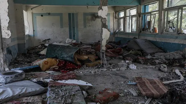 epa11392922 The destroyed UNRWA school following an Israeli air strike in Al Nusairat refugee camp in the central Gaza Strip, 06 June 2024. According to the Palestinian News Agency Wafa, at least 32 people were killed and dozens others were injured on early 06 June following an Israeli strike on a UNRWA school sheltering displaced Palestinians, located in the Nuseirat refugee camp in the central Gaza strip. The Israeli army said that it had "conducted a precise strike on a Hamas compound", whose members were " embedded in the UNRWA school". More than 36,000 Palestinians and over 1,400 Israelis have been killed, according to the Palestinian Health Ministry and the Israel Defense Forces (IDF), since Hamas militants launched an attack against Israel from the Gaza Strip on 07 October 2023, and the Israeli operations in Gaza and the West Bank which followed it. EPA/MOHAMMED SABER