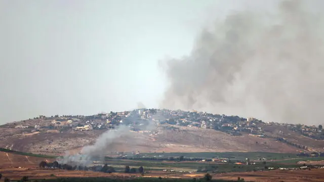 epa11456953 Smoke rises as a result of projectiles fired from south Lebanon, at Mevuot Hermon, upper Galilee, in northern Israel 04 July 2024. Israeli army reported that fighter jets struck Hezbollah targets in southern Lebanon, including a military structure in the area of Chihine and three terrorist infrastructure sites in the area of Blat. In addition, more than 100 launches were identified fired from Lebanon. EPA/ATEF SAFADI