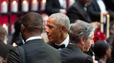 epa11364943 Former US President Barack Obama (C) greets Antony Blinken (R), US secretary of state, during a state dinner at the White House in Washington, DC, USA, 23 May 2024. An American president is hosting a state visit for an African leader for the first time in 16 years, as the world's biggest economy struggles to build influence on a continent forging closer relations beyond Washington's top competitors China and Russia. EPA/Al Drago / POOL