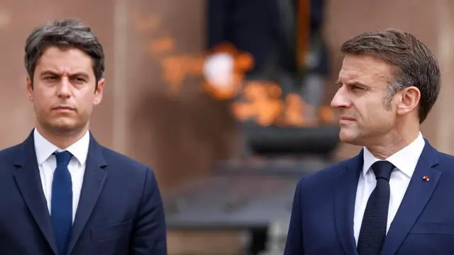 epa11419486 French President Emmanuel Macron (R) and France's Prime Minister Gabriel Attal (L) attend a ceremony marking the 84th anniversary of late French General Charles de Gaulle's World War II resistance call 'Appeal of 18 June' in 1940, at the Mont-Valerien memorial in Suresnes, outside Paris, France, 18 June 2024. EPA/LUDOVIC MARIN / POOL MAXPPP OUT