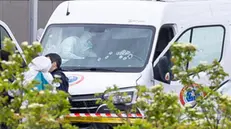 epa11340384 French forensic police inspect a vehicle at the toll station of Incarville, near Rouen, in the North of France, where gunmen ambushed a prison van on 14 May 2024, killing two prison guards and helping a prisoner to escape. Three other prison guards were severely wounded, according to Justice minister Eric Dupond-Moretti. A major police manhunt has been launched to find the gunmen and the escaped prisoner, identified as a 30-year-old drug dealer from northern France, according to the Paris prosecutor's office. EPA/CHRISTOPHE PETIT TESSON