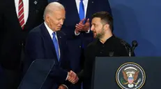 epa11473435 US President Joe Biden (L) and Ukraine President of Ukraine Volodymyr Zelensky (R) shake hands during a ceremony for the â€˜Ukraine Compactâ€™ during the North Atlantic Treaty Organization (NATO) Summit in Washington, DC, USA, 11 July 2024. The 75th Anniversary NATO Summit takes place in Washington, DC, from 09 to 11 July 2024. EPA/WILL OLIVER
