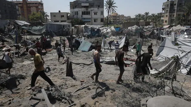 epa11475526 Palestinians inspect their tents after an Israeli raid on the tents of displaced people in the Al-Mawasi area of Khan Yunis in the southern Gaza Strip, 13 July 2024. Since 07 October 2023, up to 1.7 million people, or more than 75 percent of the population, have been displaced throughout the Gaza Strip, some more than once, in search of safety, according to the United Nations Relief and Works Agency for Palestine Refugees in the Near East (UNRWA), which added that the Palestinian enclave is 'on the brink of famine', with 1.1 million people (half of its population) 'experiencing catastrophic food insecurity' due to the conflict and restrictions on humanitarian access. EPA/HAITHAM IMAD